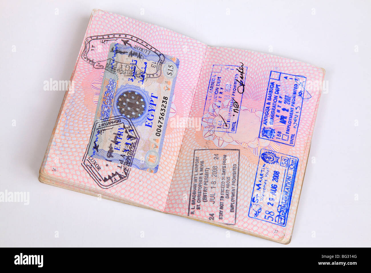 UK Passport pages with destination stamps from different countries. Stock Photo