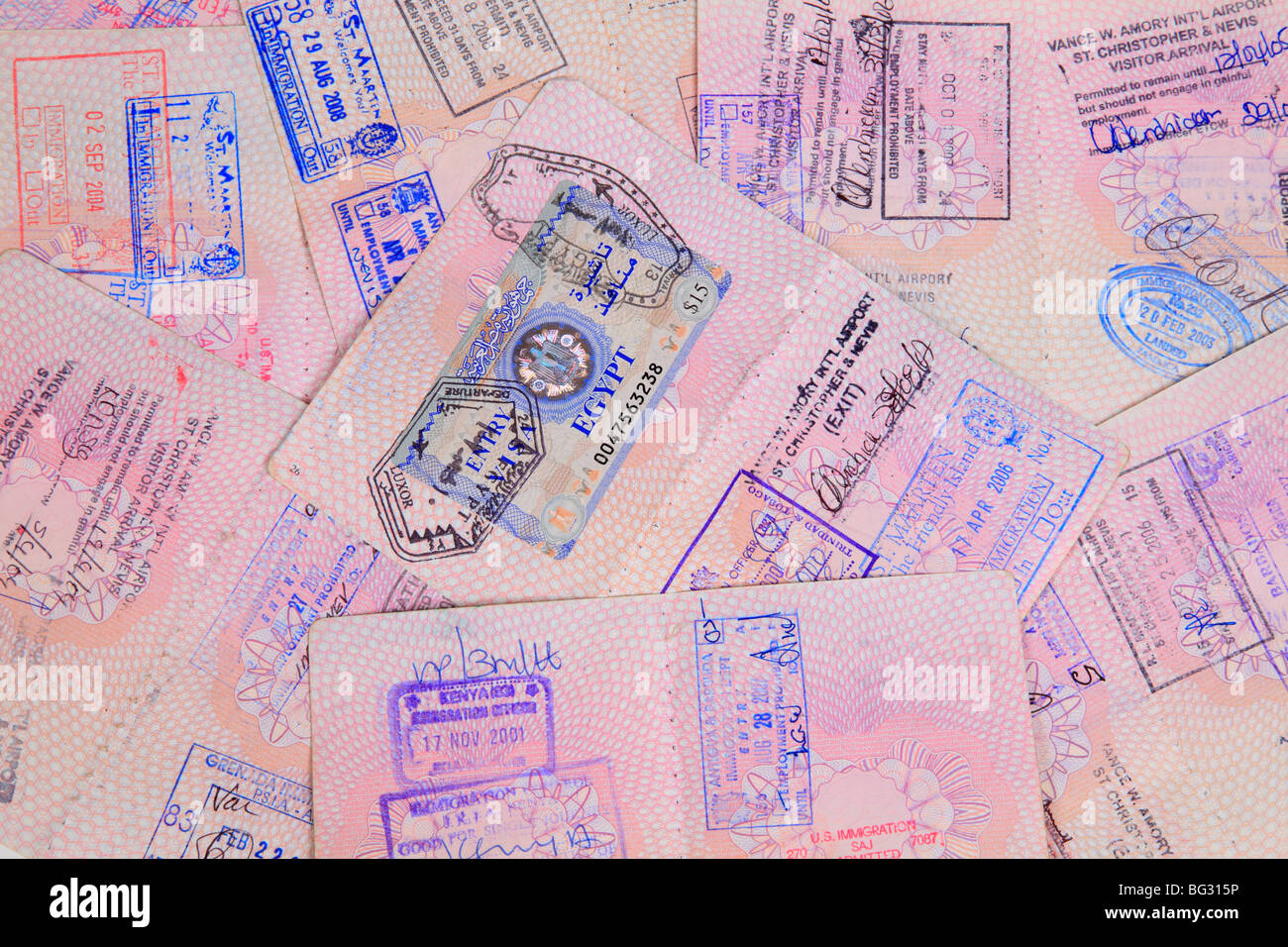 UK Passport pages with destination stamps from different countries. Stock Photo