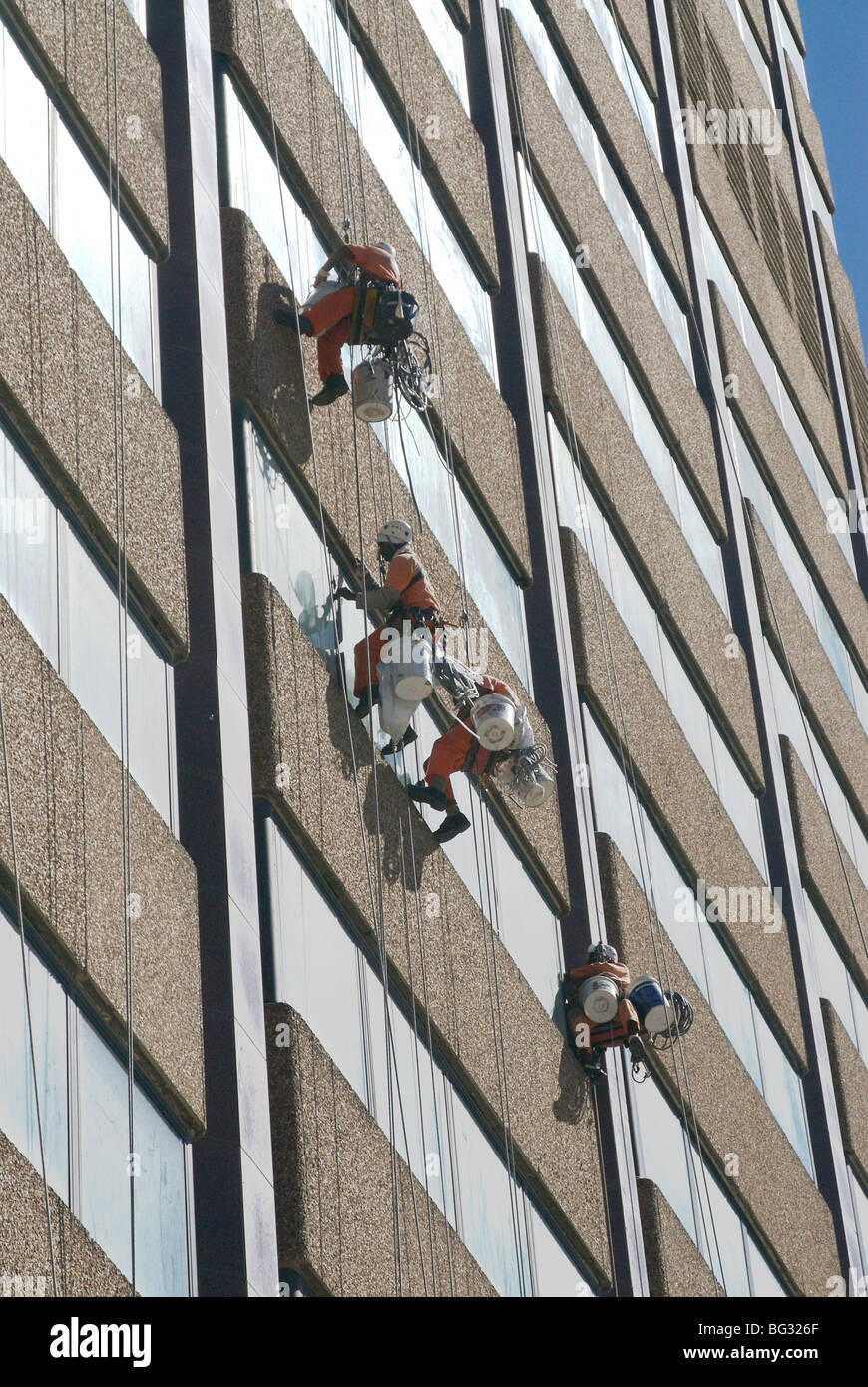 High Rise Building Cleaning These people were cleaning and repairing windows on a high rise ...