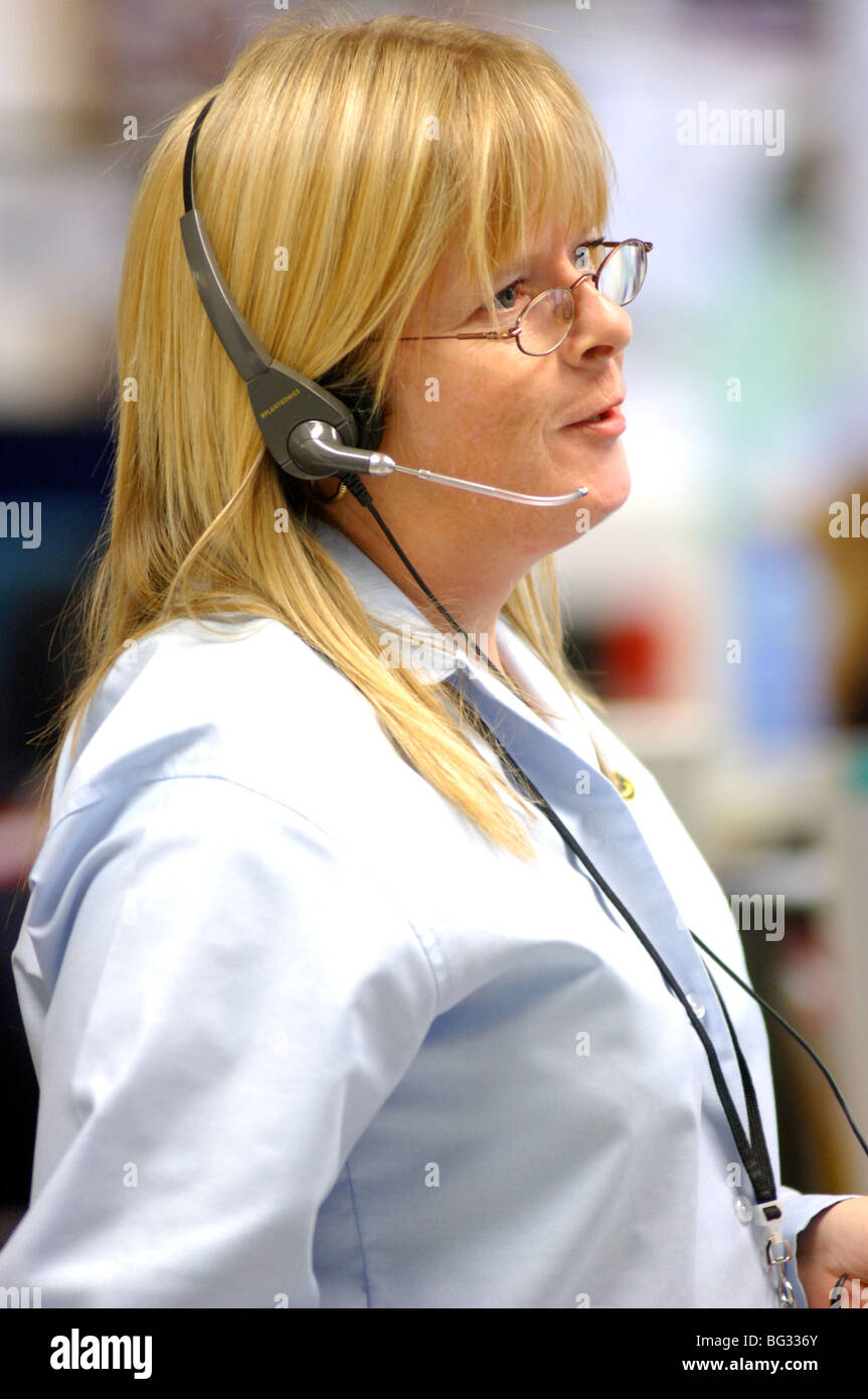 Royalty free photograph of customer support operator helping client on telephone in UK London