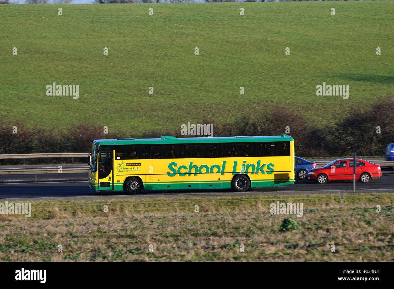 School bus on M40 motorway, Warwickshire, England, UK Stock Photo
