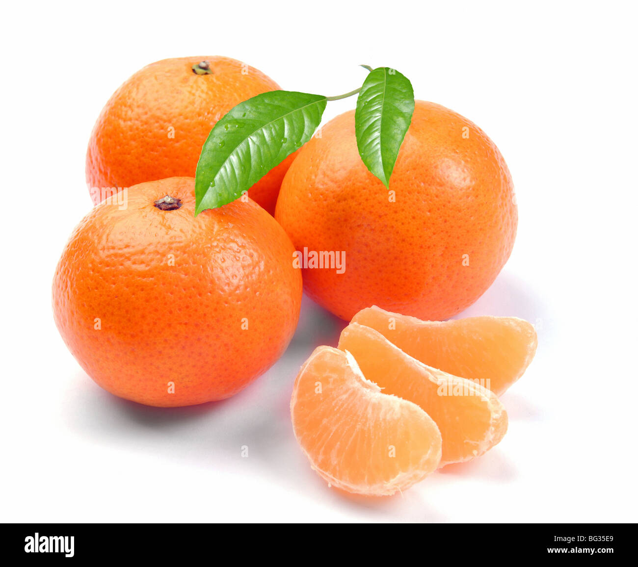 clementines with segments on a white background Stock Photo Alamy
