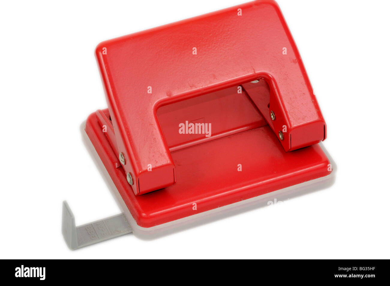 Red office paper hole puncher, isolated on white background Stock Photo -  Alamy