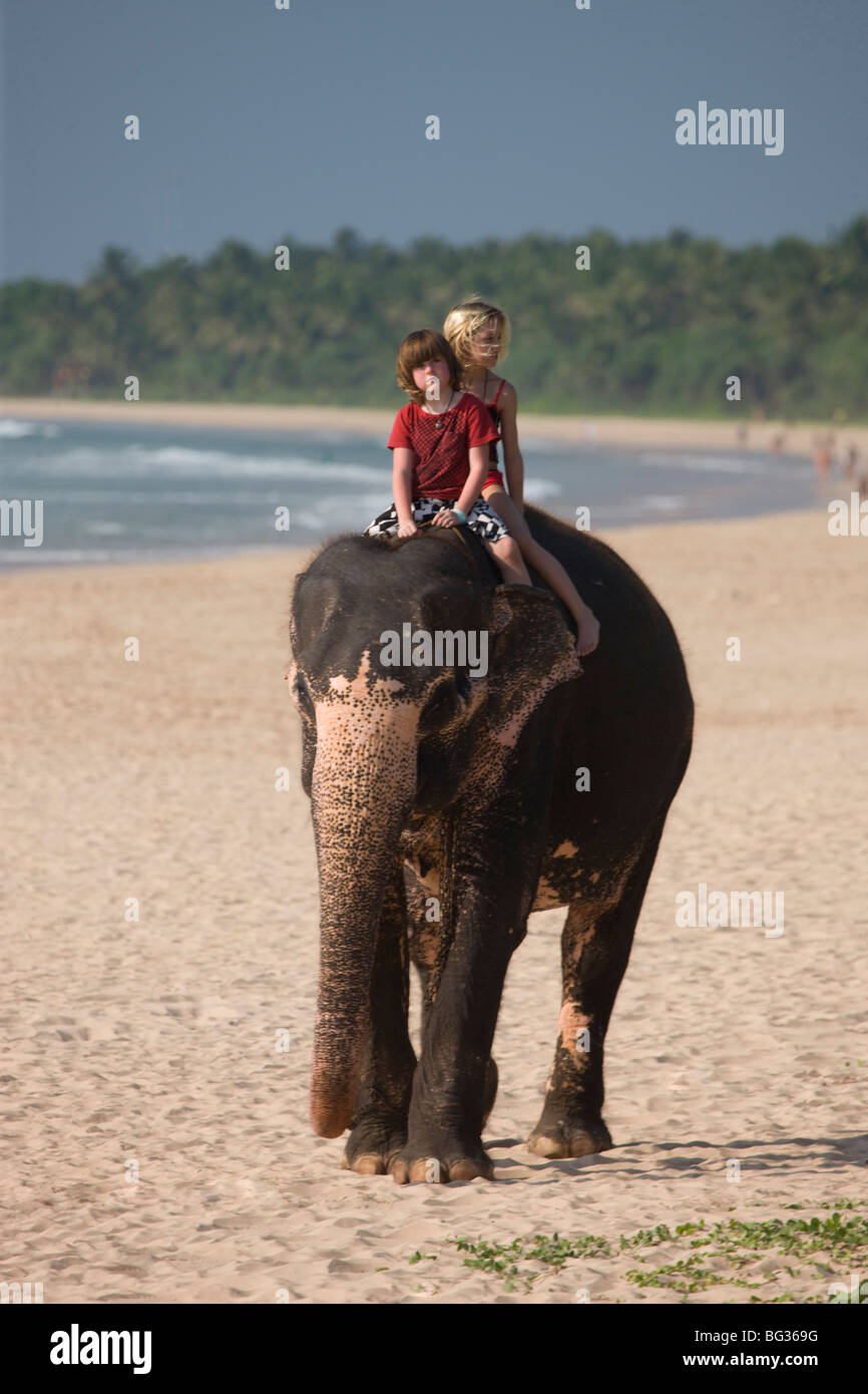 Girl riding an elephant hires stock photography and images Alamy