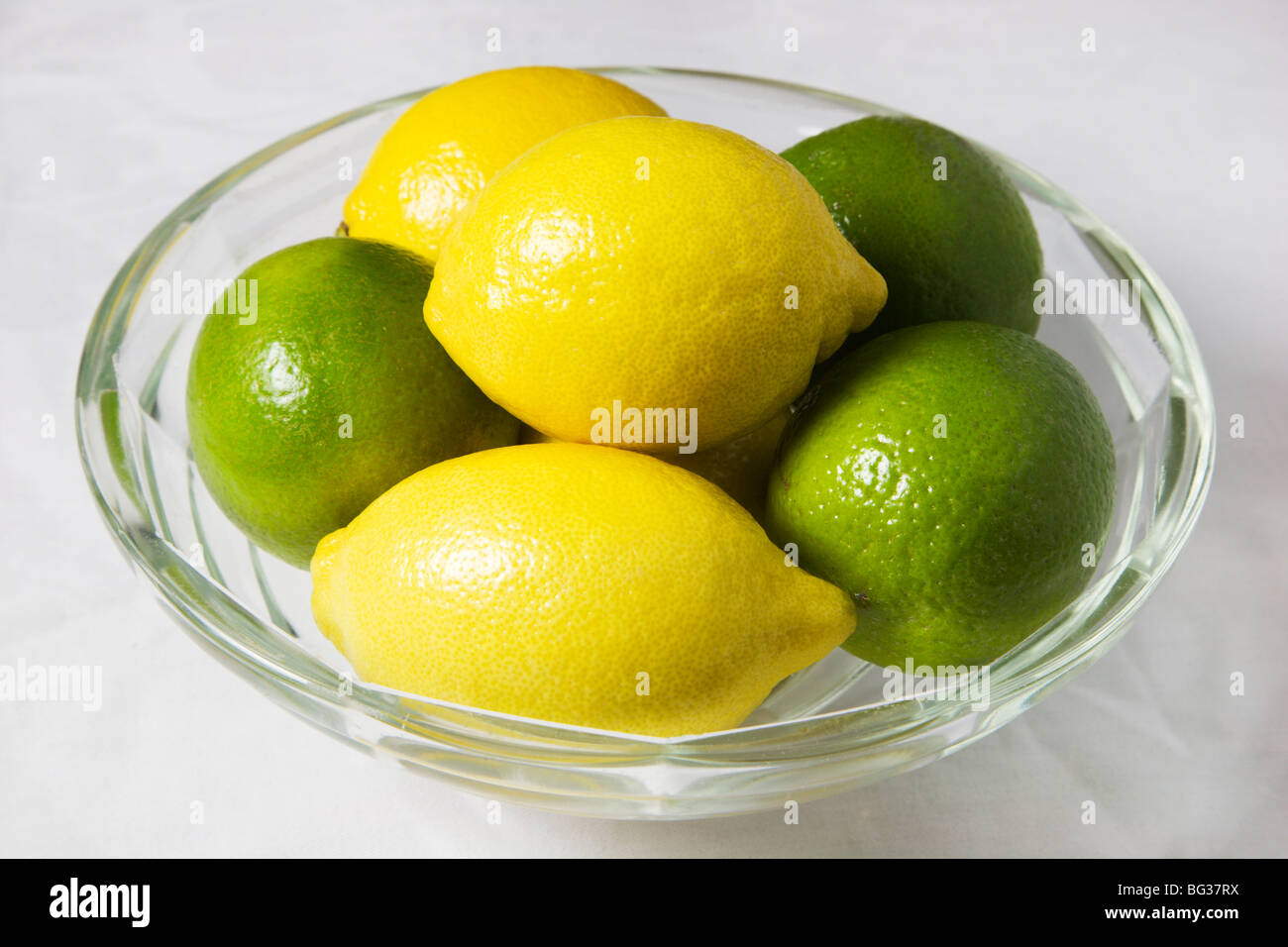 Lemons and Limes in a Glass Bowl Stock Photo Alamy