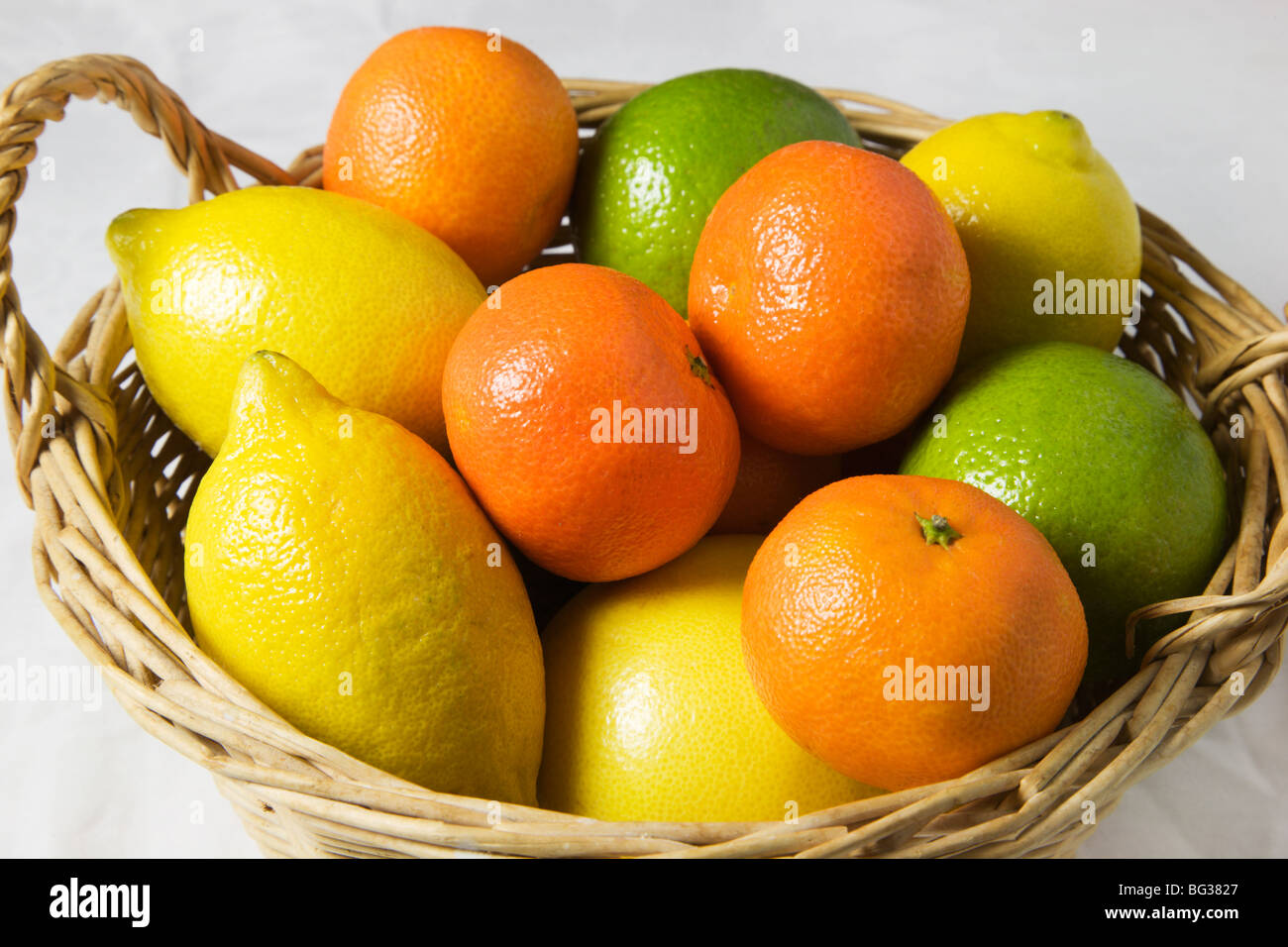 Mixed Citrus Fruits in a Basket Stock Photo Alamy