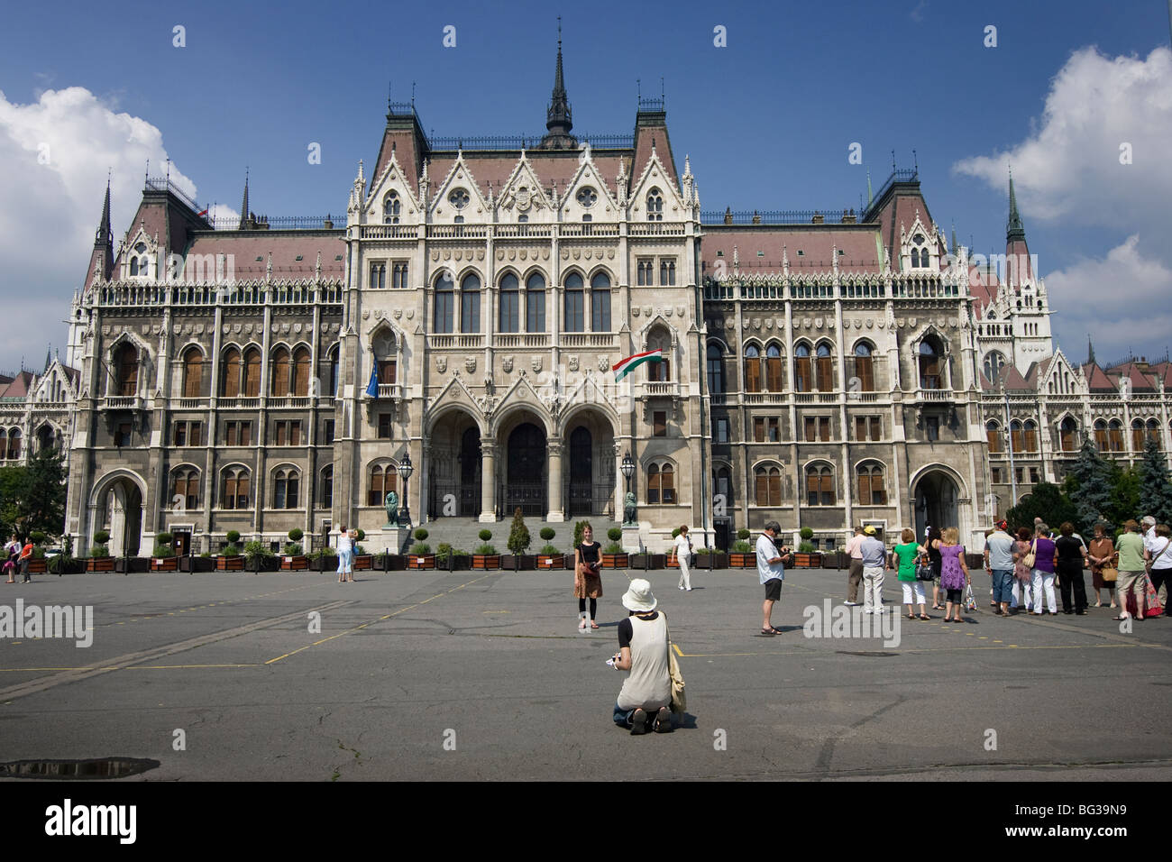 Tourists in front of parliament building,  Hungarian Parliament Building, Budapest, Hungary Stock Photo