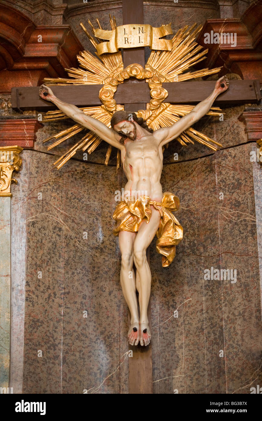 Interior of a catholic church with jesus christ on the cross Stock Photo