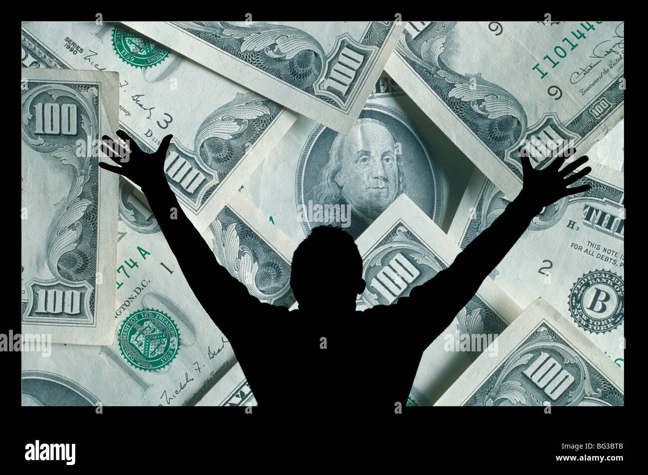 silhouette of man celebrating an image of money Stock Photo