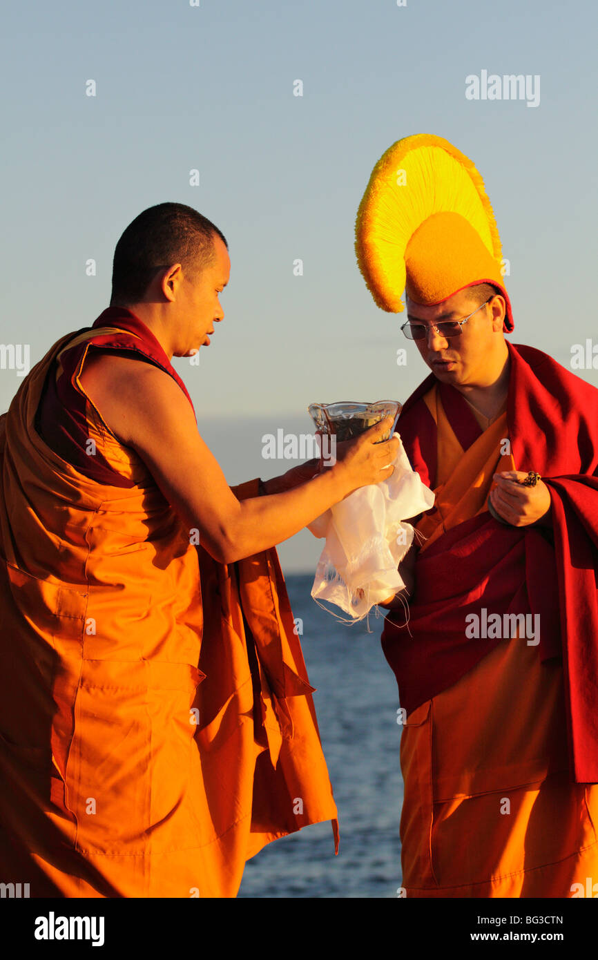 Tibetan monks performing mandala dismantling ceremony-Victoria, British Columbia, Canada. Stock Photo