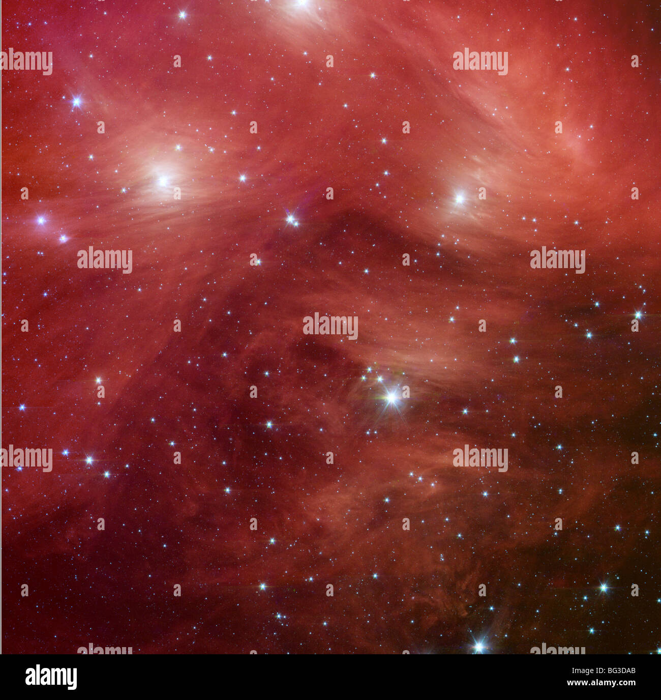 NASA infrared image from Spitzer Space Telescope of the Pleiades galaxy also known as Seven Sisters Stock Photo