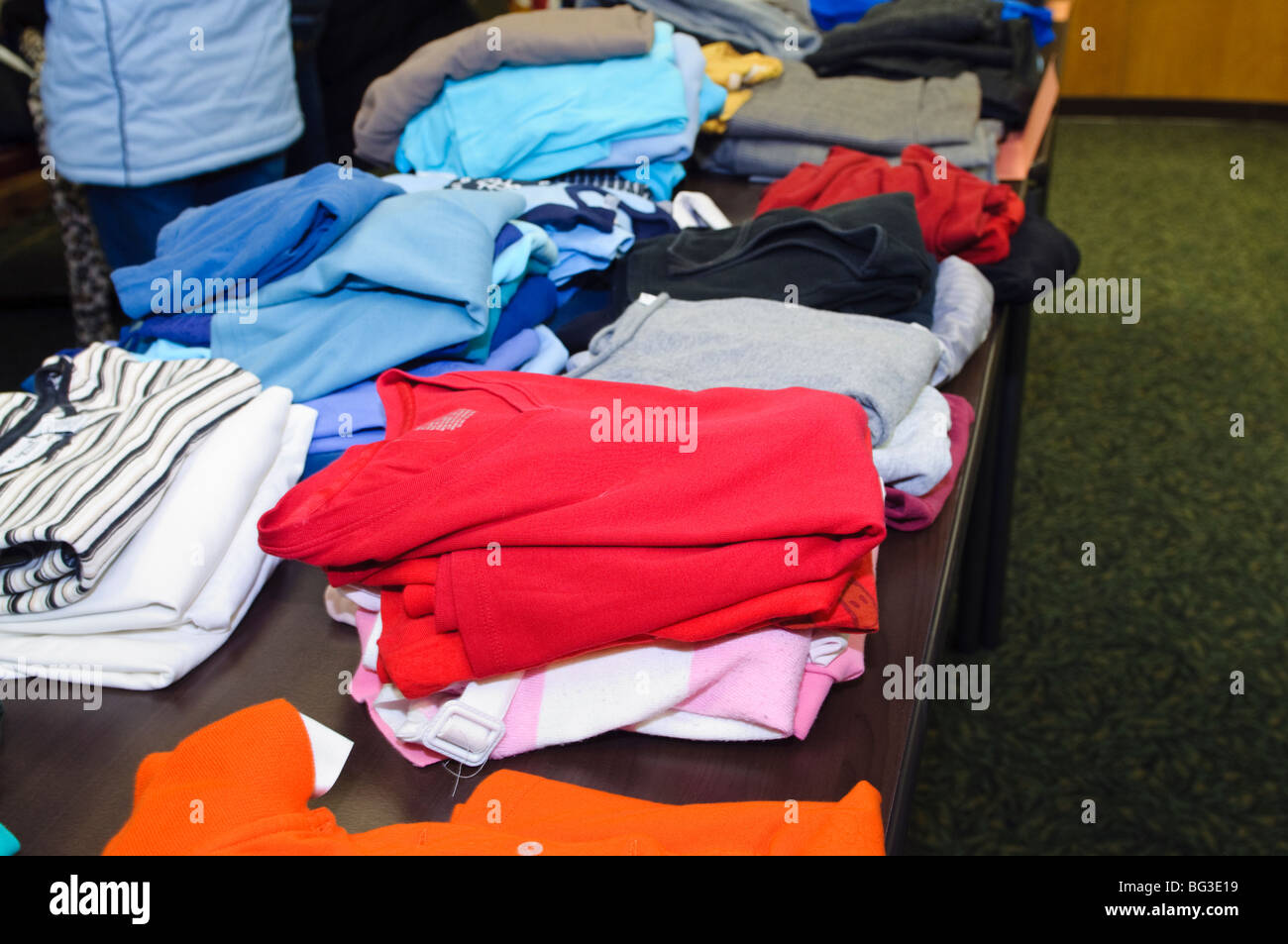Community outreach clothing giveaway to help needy citizens. Stock Photo