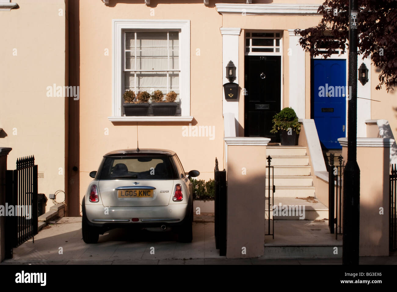 Front door of a house with a Mini car parked in the drive in Notting ... Front door of a house with a Mini car parked in the drive in Notting ...
