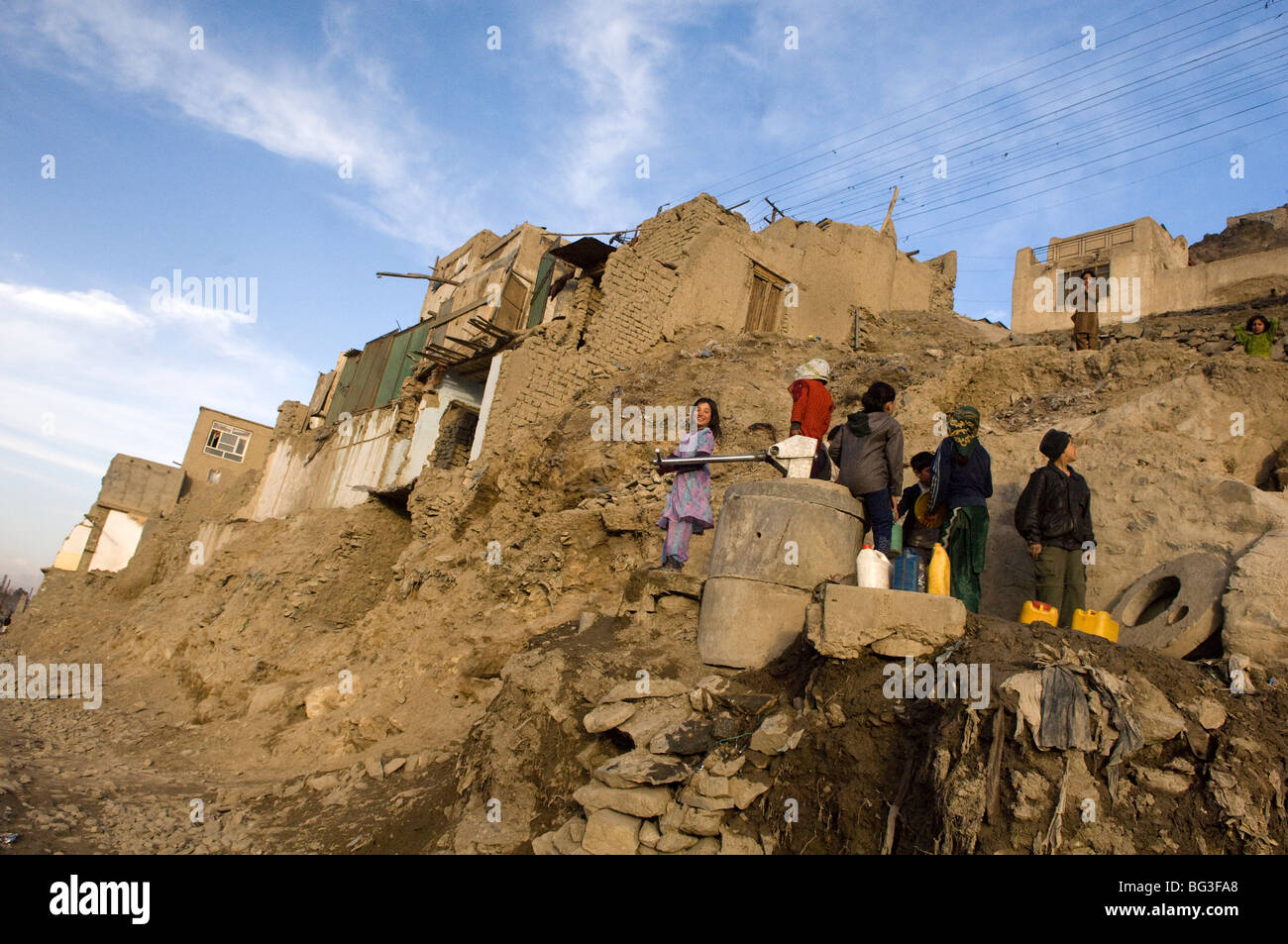 Afghans collect water in Kabul city, Afghanistan. Stock Photo