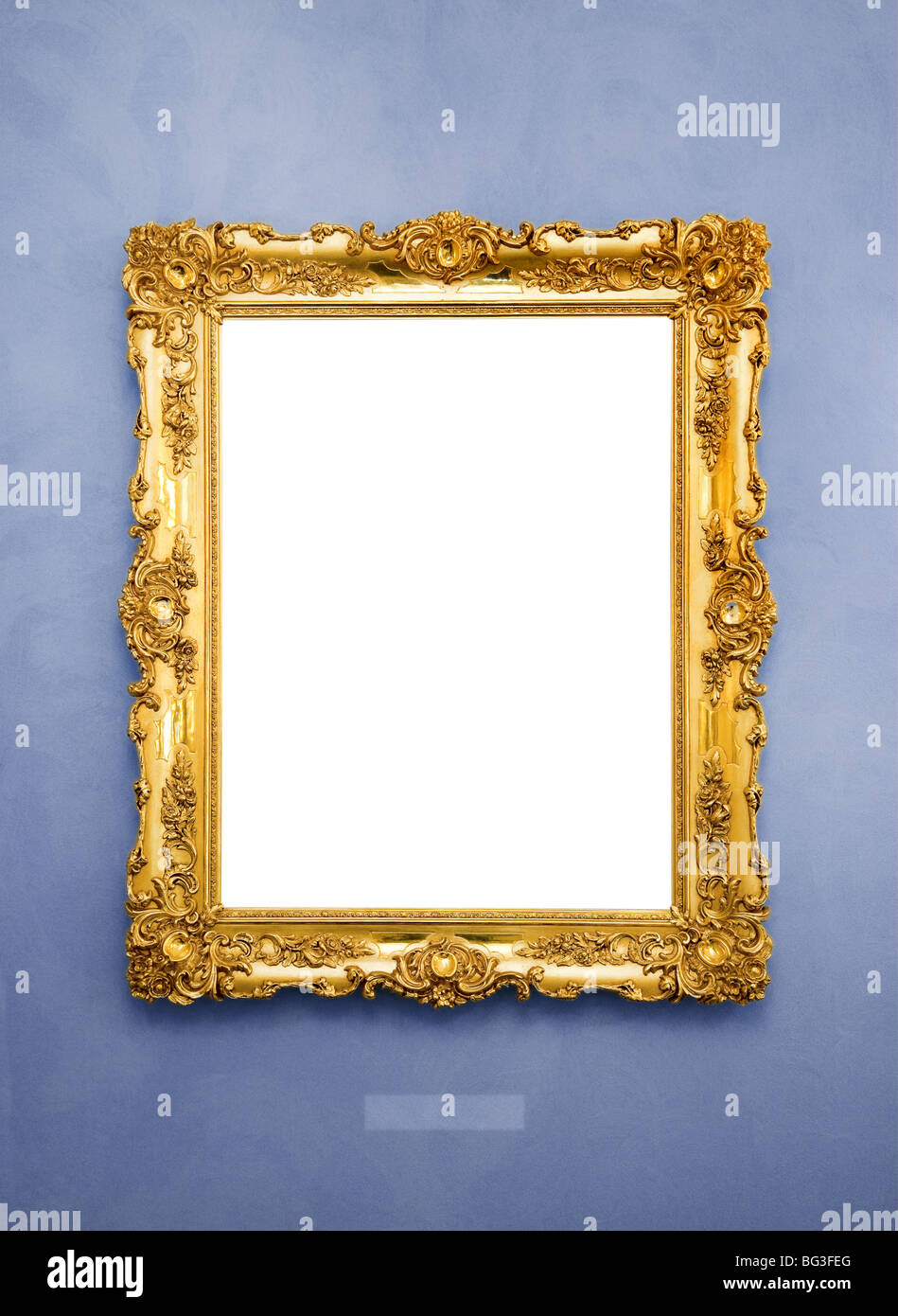 Ornate picture frame on a blue wall Stock Photo Alamy