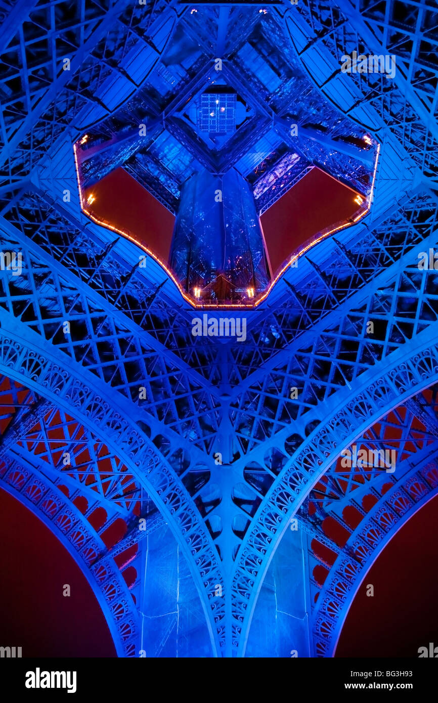 Underside of Eiffel Tower illuminated at night with Euro Presidency colours. Stock Photo