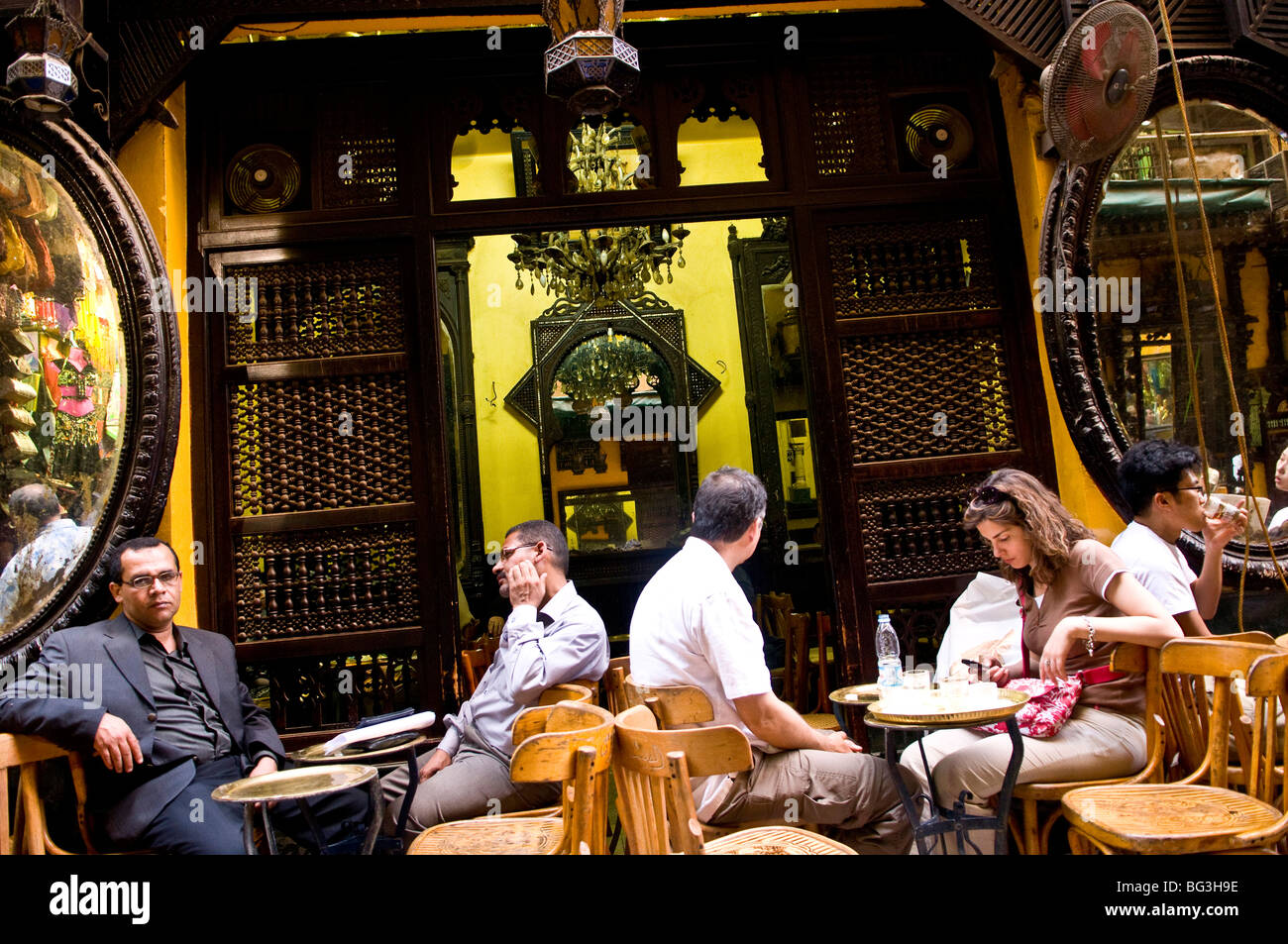 Scenes at the vibrant  El Fishawi tea house in the old Khan El Khalili bazaar in Cairo, Egypt. Stock Photo