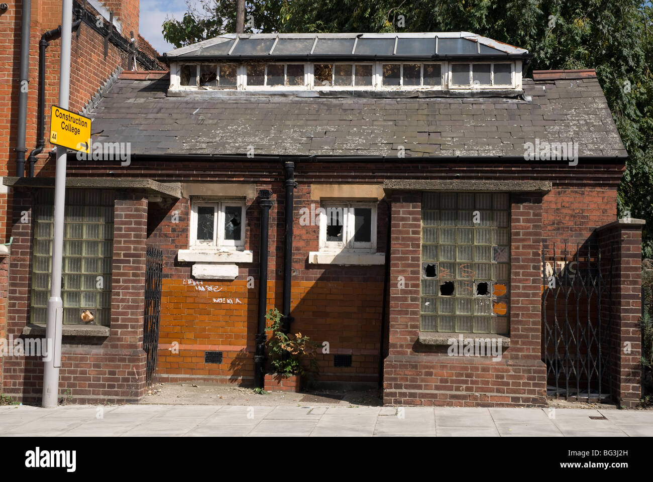 Disused boarded up public convenience in North Woolwich London Stock Photo