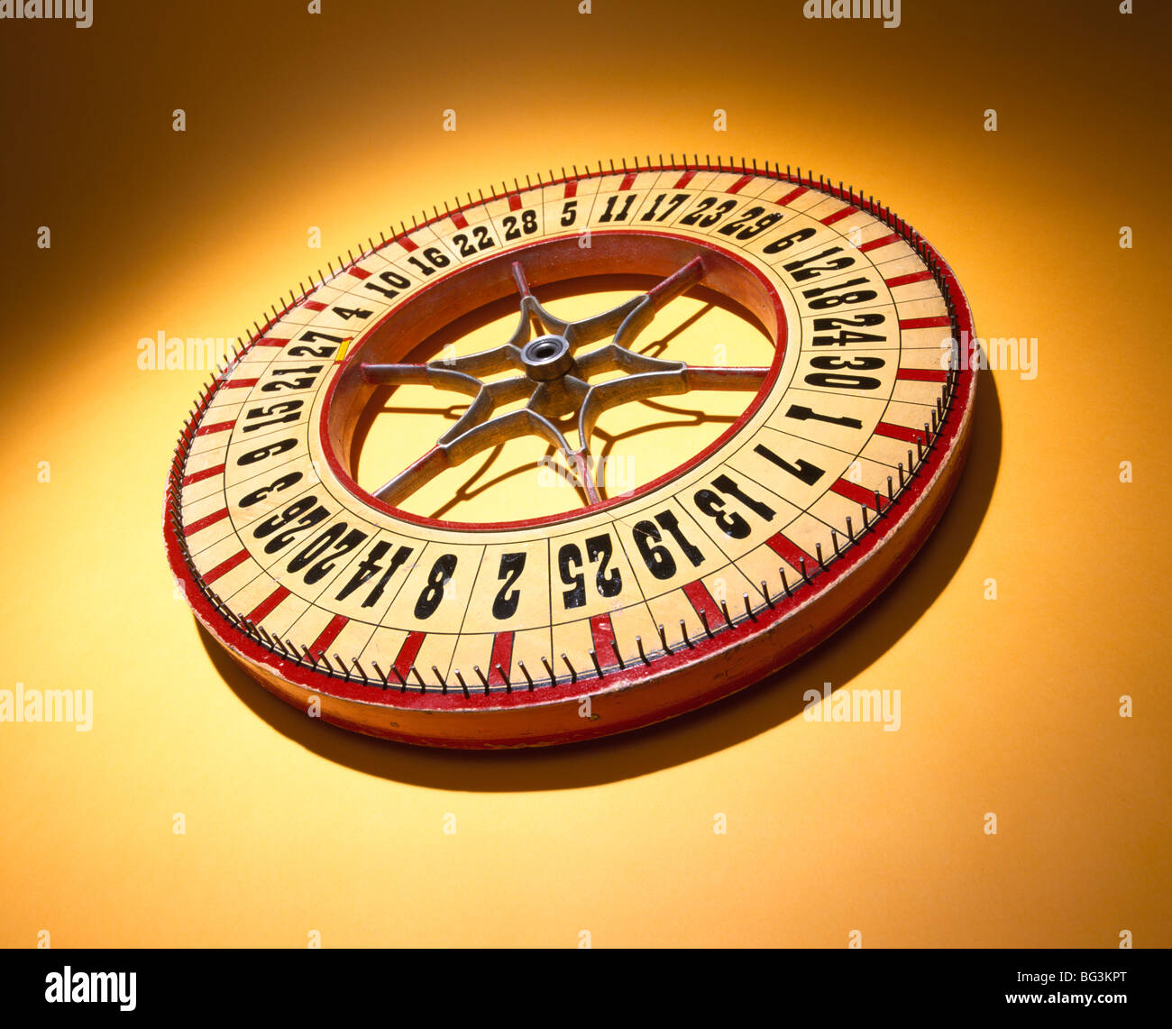 A round wooden wheel of chance numbers, roulette Stock Photo