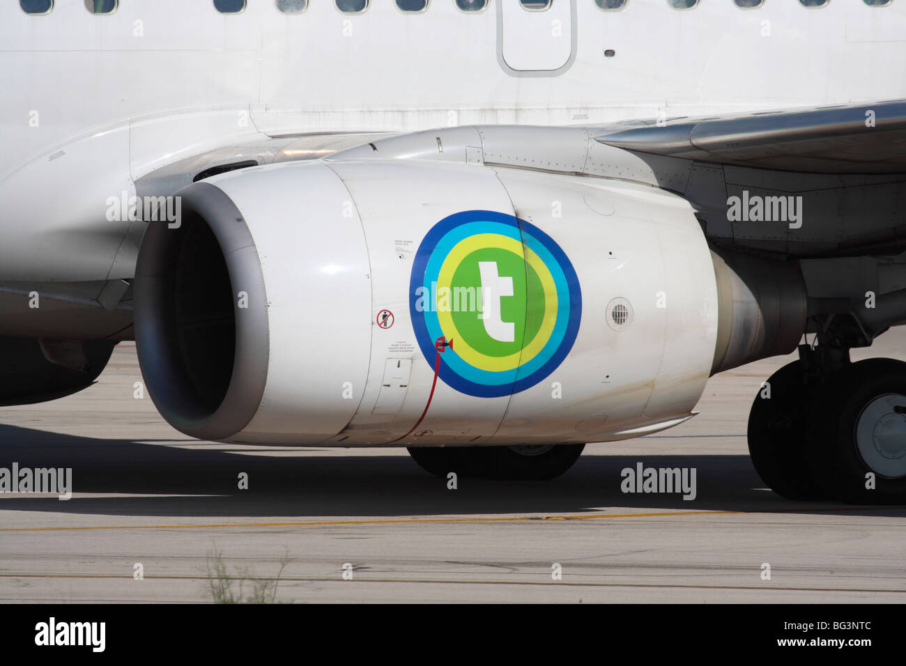 CFM International CFM56 turbofan jet engine nacelle on the wing of a Transavia Boeing 737-700 commercial passenger airplane Stock Photo