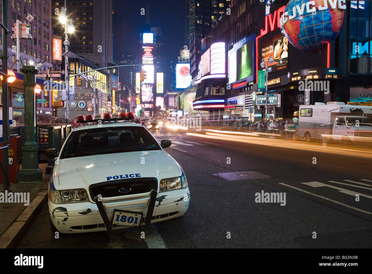 NYPD police car parked at Times Square at night, Manhattan, New York, United States of America, North America Stock Photo