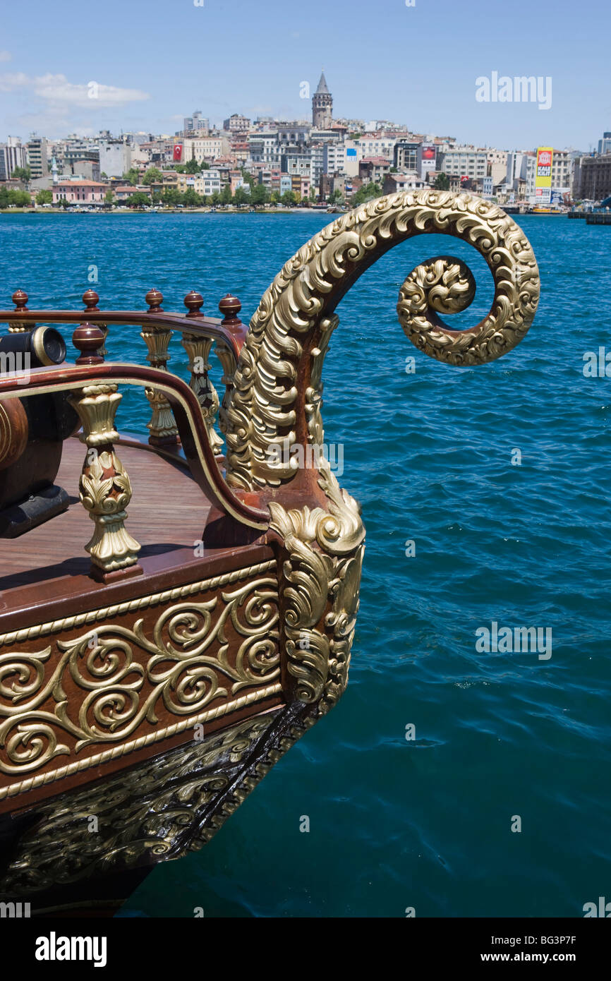 Decorative boat on the Golden Horn with the Galata Tower and Beyoglu district in the background, Istanbul, Turkey, Europe Stock Photo