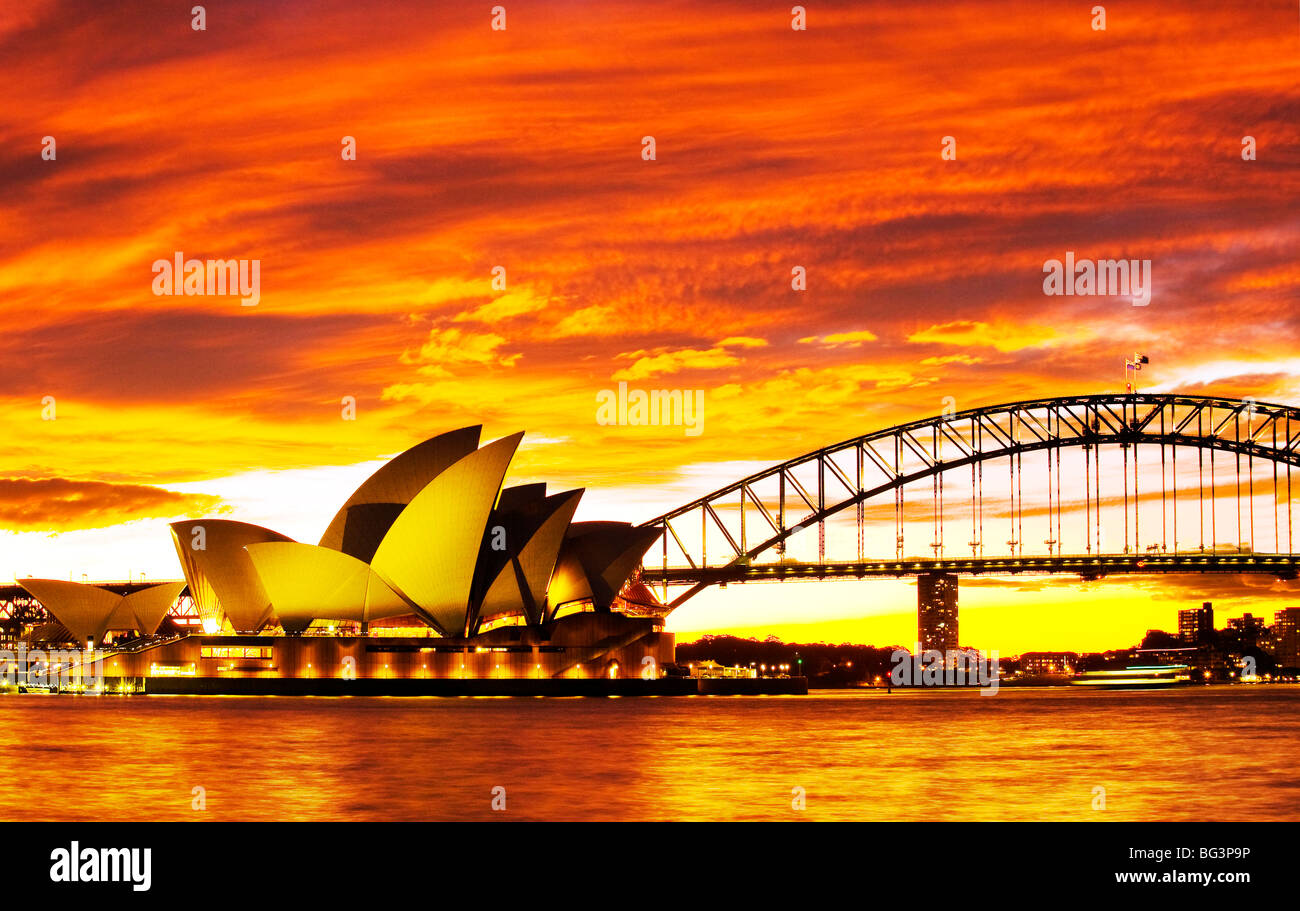 Australia, New South Wales, Sydney Opera House and Sydney Harbour Bridge at sunset Stock Photo