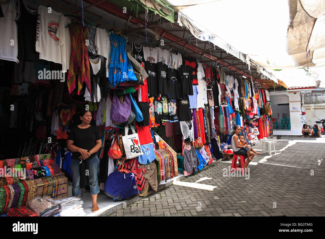 market stalls selling clothing, bags and homewares in a gang (alleyway