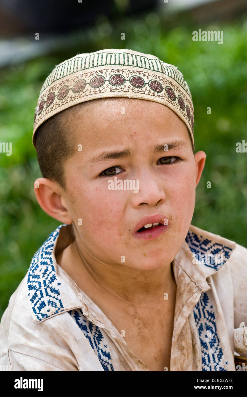 Portrait of an Uighur boy. Stock Photo