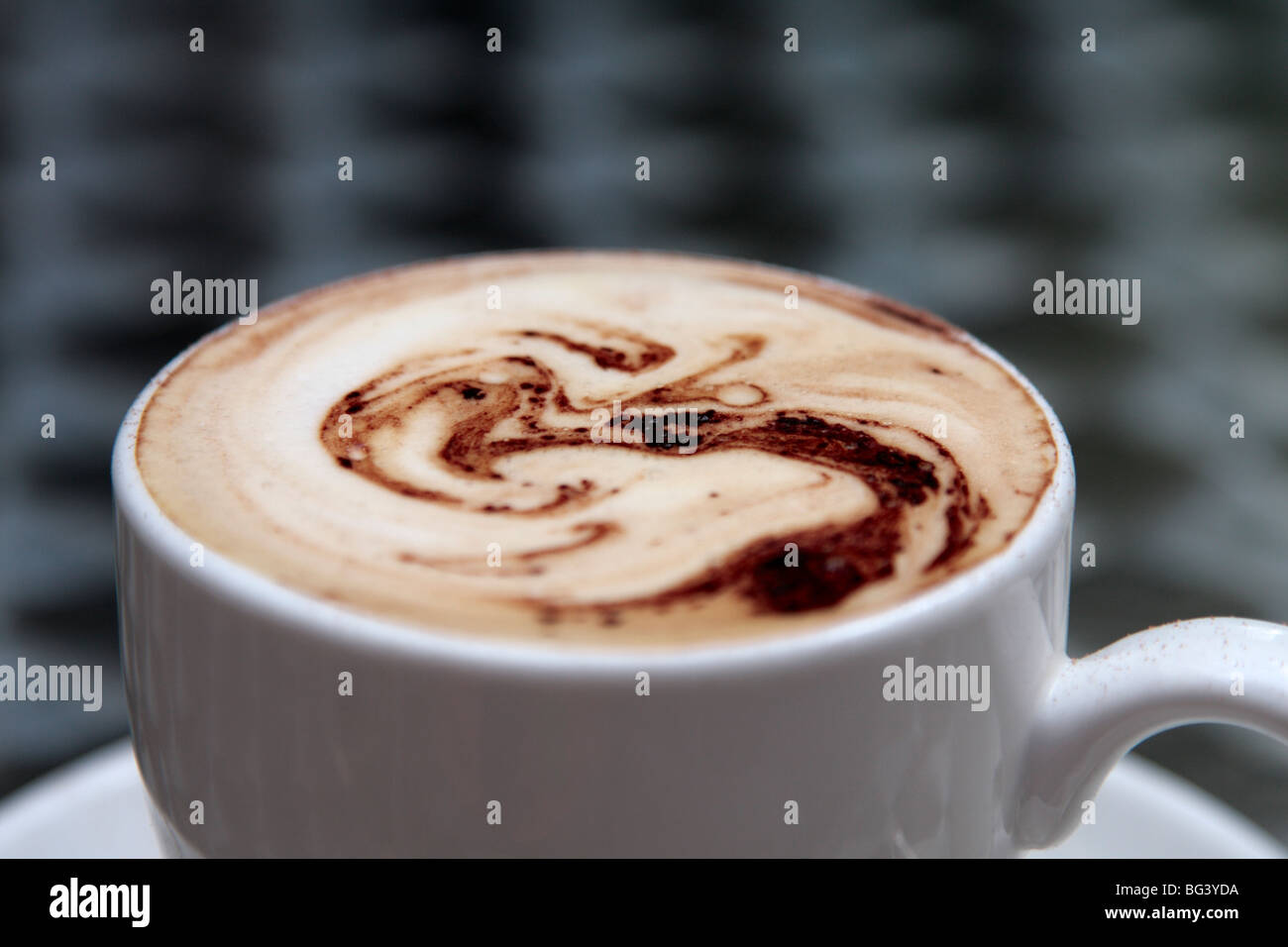 Cappucino coffee with swirls of chocolate on top Stock Photo