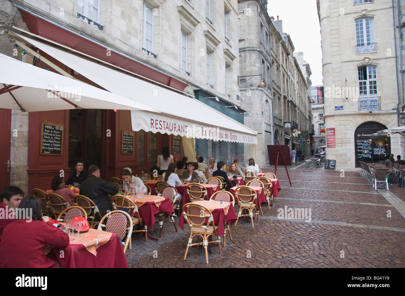 Terrace seating at restaurant in Place Saint-Pierre, Bordeaux, Gironde, France, Europe Stock Photo
