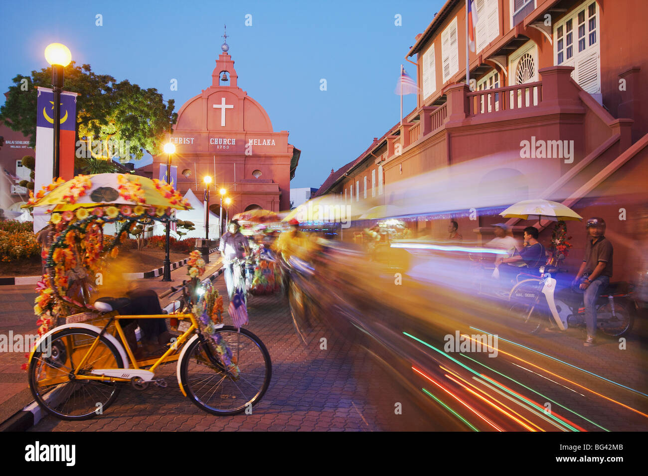 Trishaws passing in Town Square, Melaka, Malaysia, Southeast Asia, Asia Stock Photo