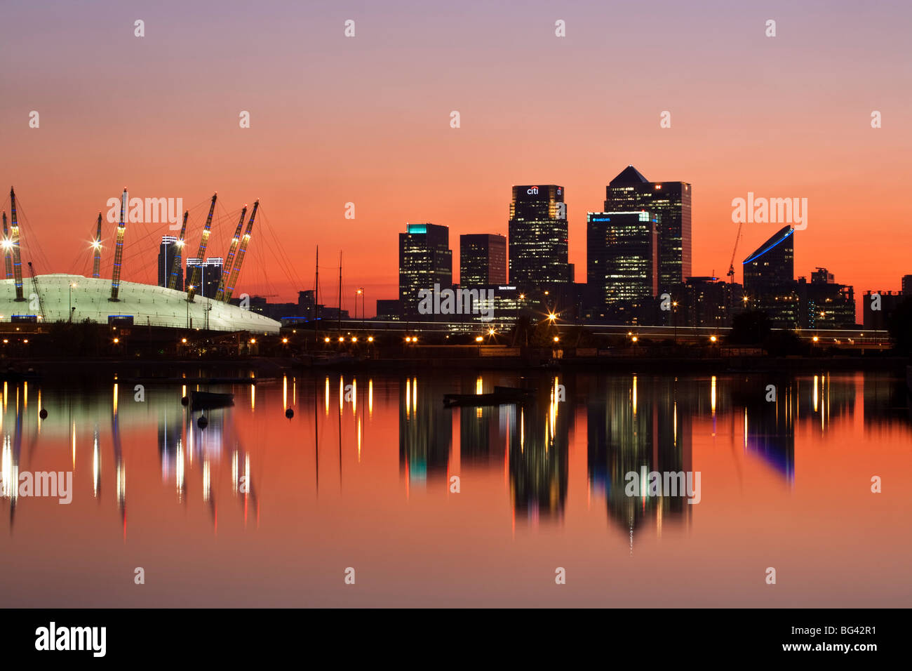 England, London, Newham,O2 Arena and Canary Wharf buildings reflecting in  Royal Victoria Docks Stock Photo