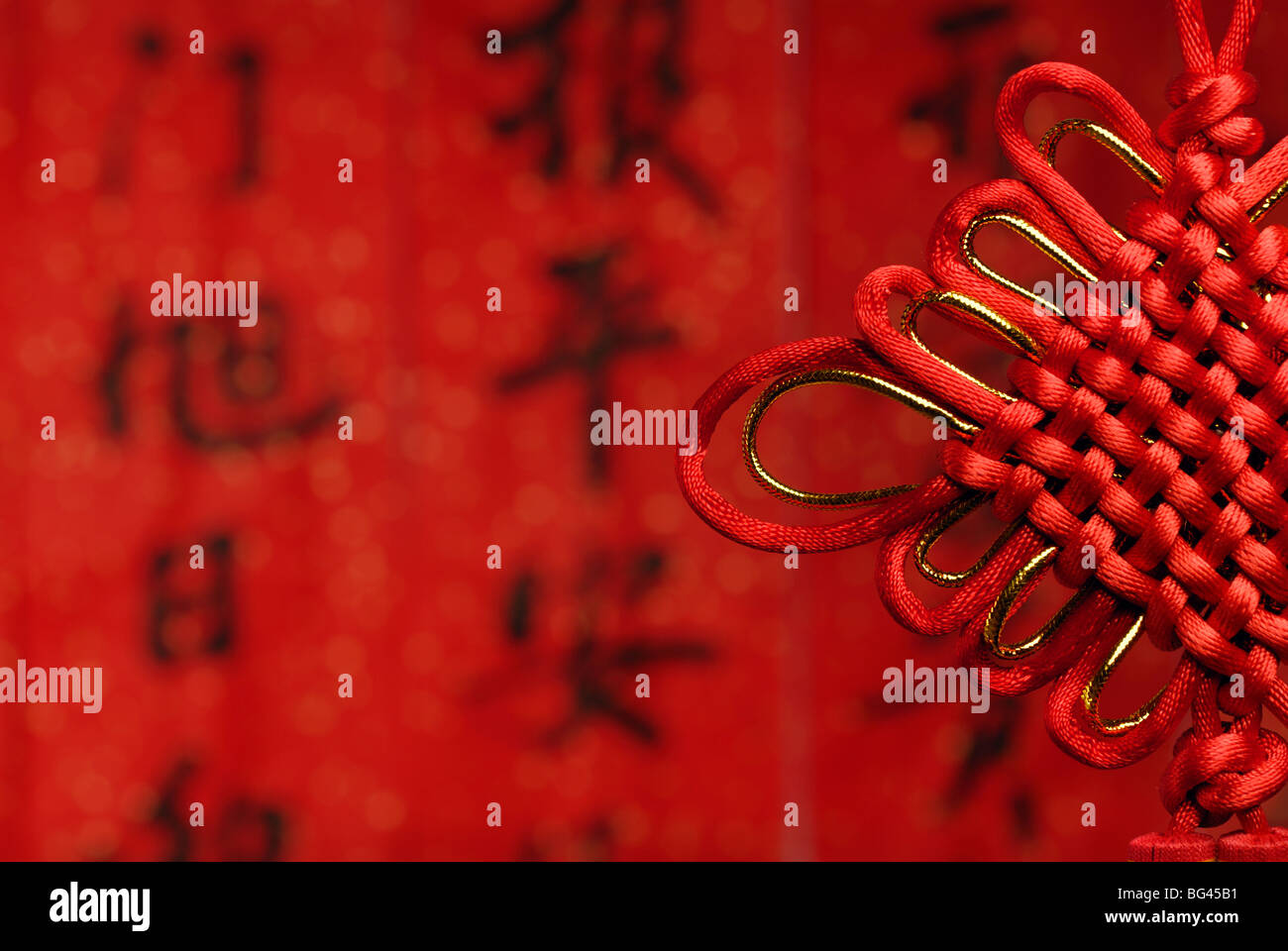 Chinese good luck knot on a festive background Stock Photo - Alamy
