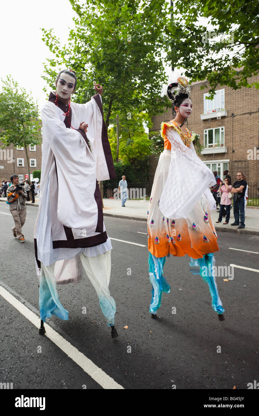 England, London, Notting Hill Carnival, Chinese Stilt Walkers Stock