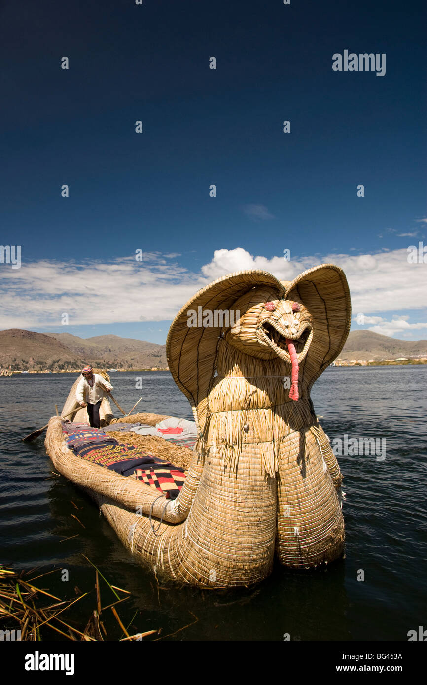 Reed boat with decorative bow, amid floating islands of the Uros people, Lake Titicaca, Peru, South America Stock Photo