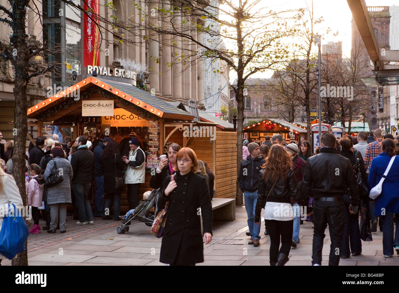 UK, England, Manchester, St Annes Square Christmas Market shoppers queueing at Chocolate stall Stock Photo