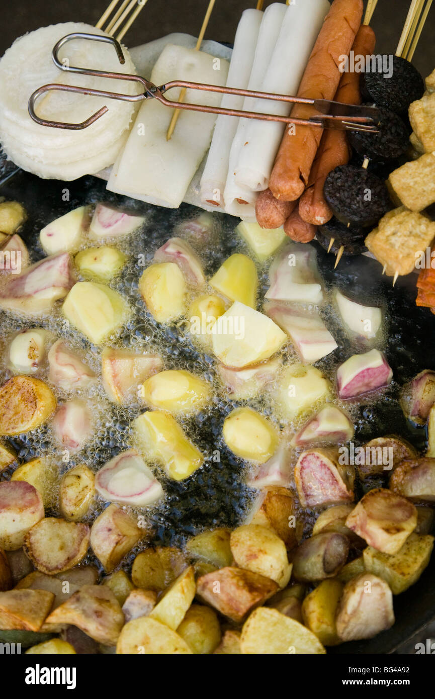 China, Yunnan Province, Lijiang, Old Town, Lijiang Market, fried potatoes and snacks Stock Photo