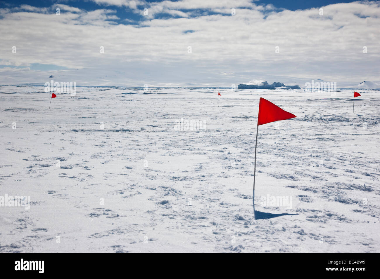 Flags on sea ice, Cape Washington, Ross Sea, Antarctica. Stock Photo
