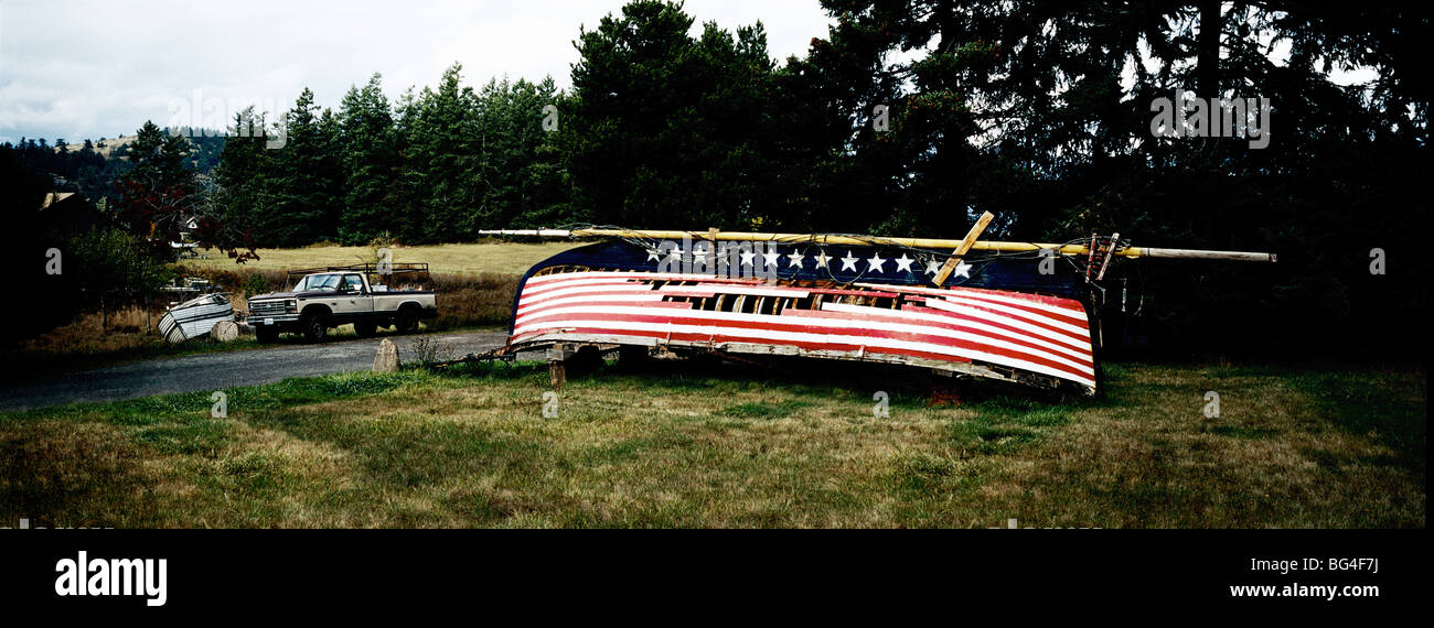 Upturned derelict boat with stars and stripes painted on hull, Washington state, United States of America, North America Stock Photo