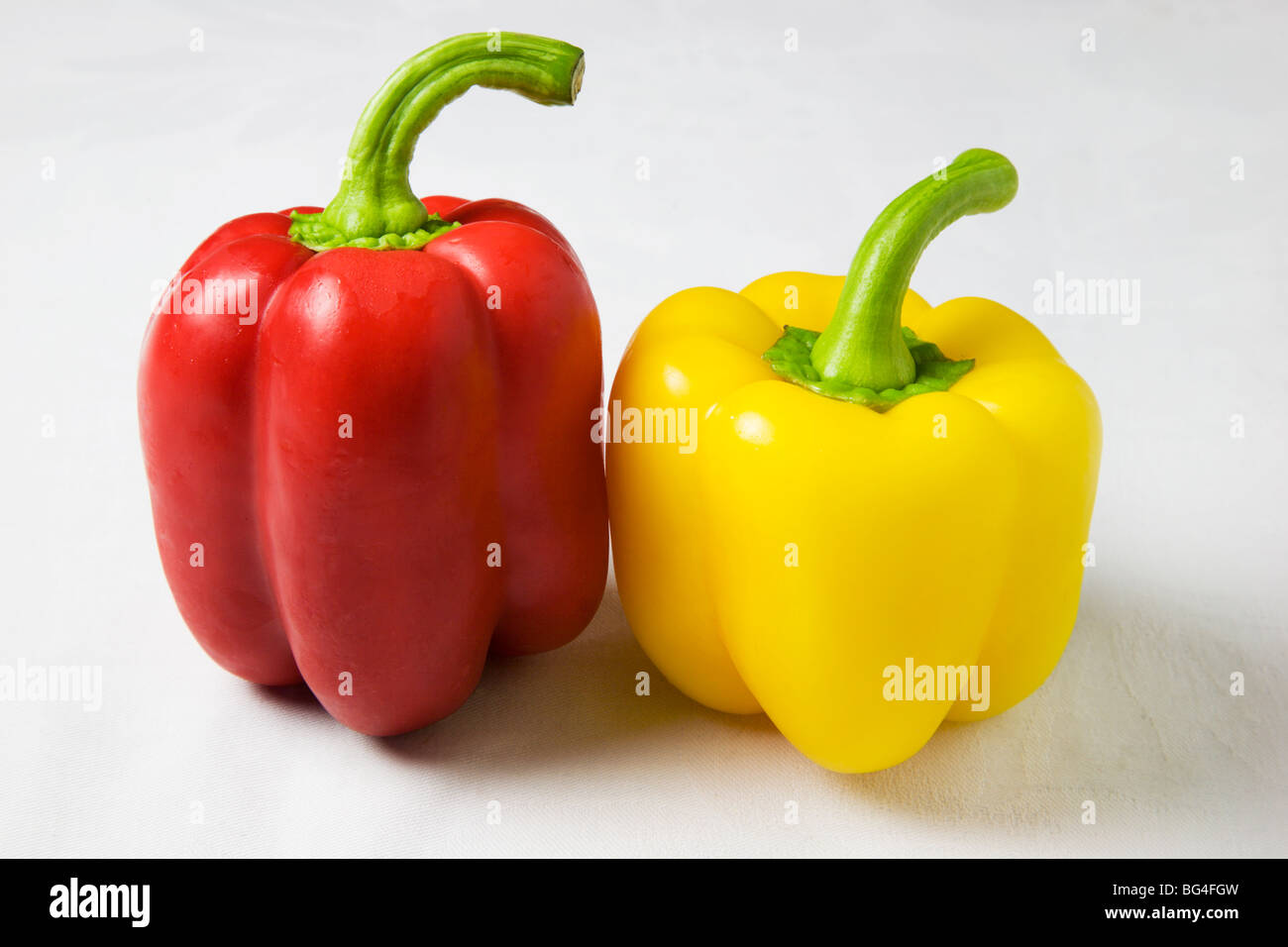 Red and Yellow Peppers on a White Background Stock Photo - Alamy