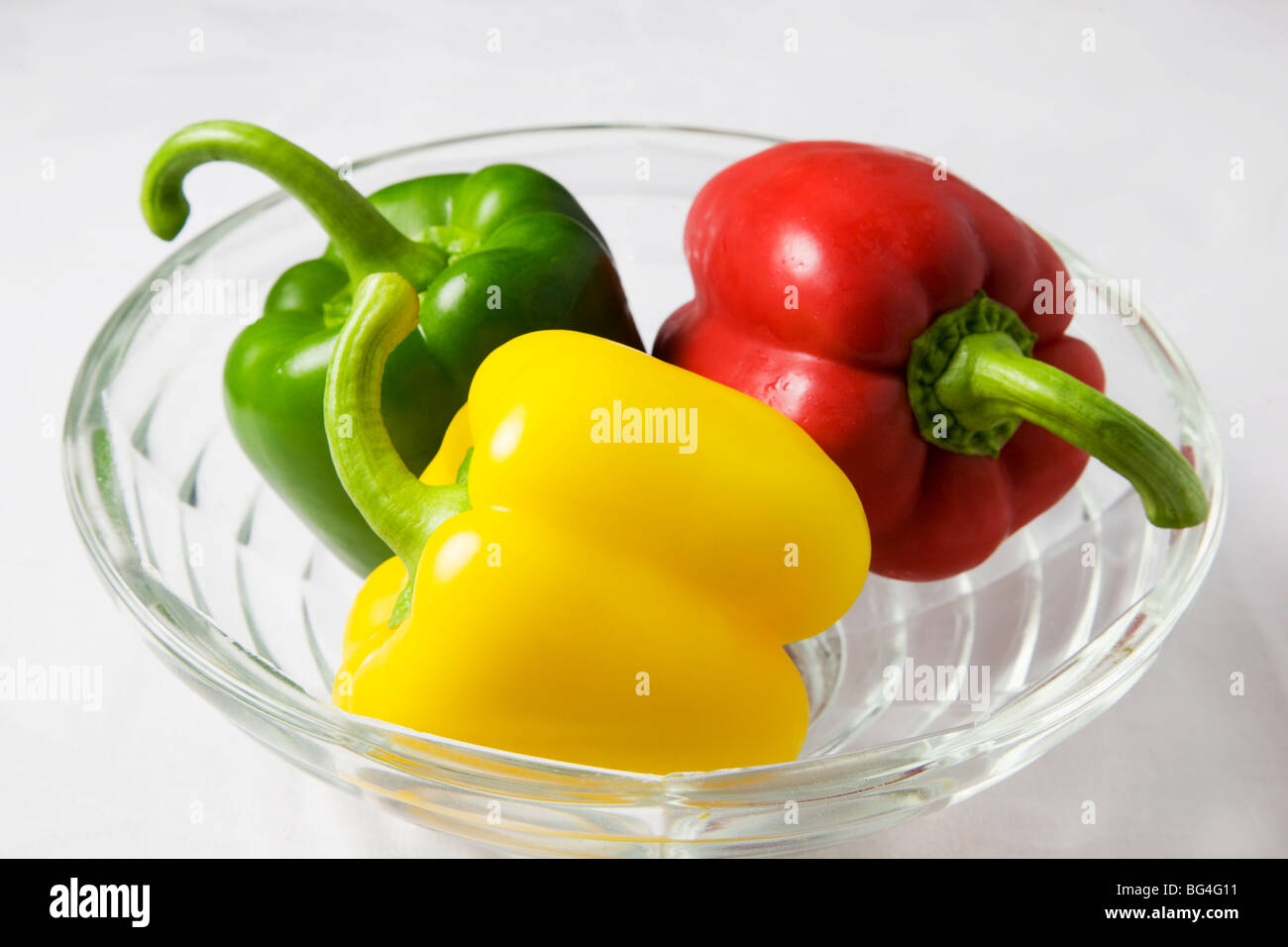 Red Yellow and Green Peppers in a Glass Bowl Stock Photo - Alamy