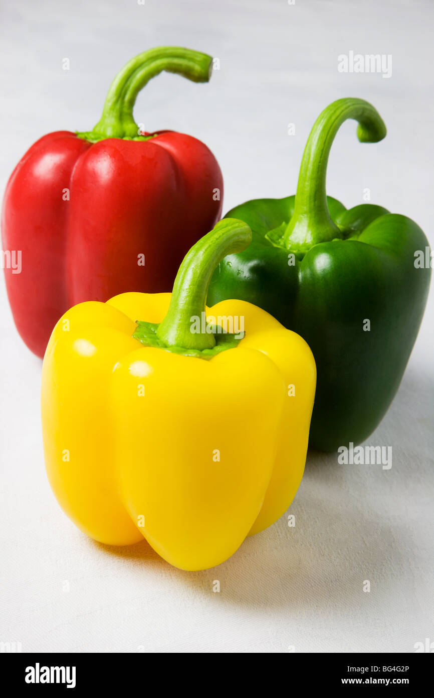 Red Yellow and Green Peppers on a White Background Stock Photo - Alamy