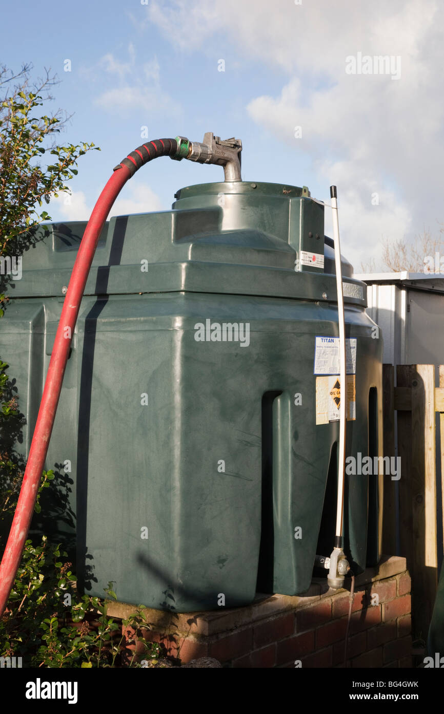 Britain, UK, Europe. Filling a domestic oil tank with supply pipe and nozzle in the top Stock