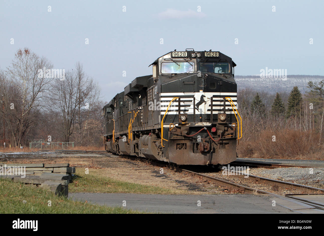 Three diesel electric locomotives waiting on a siding in the country. Freight locomotives from the Norfolk Southern Stock Photo
