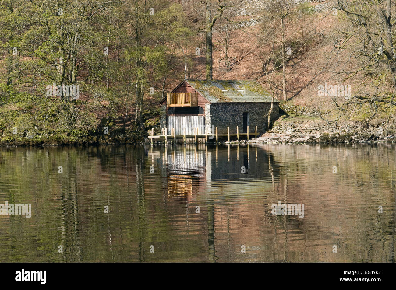 Boathouse and reflection on Ullswater , Cumbria , England Stock Photo