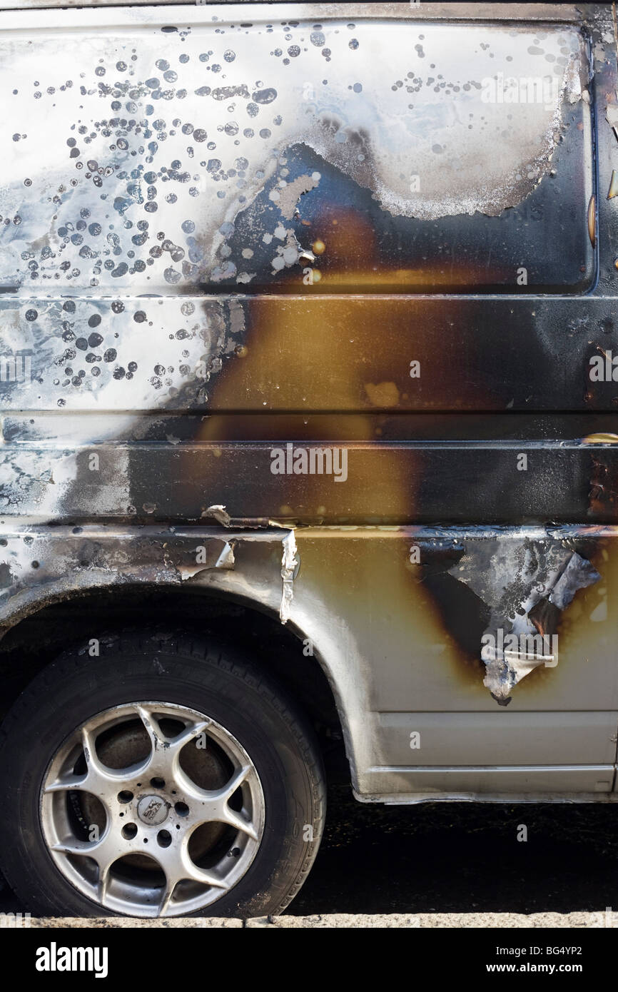 Scorched paintwork of a van after an inner-city estate fire in south London. Stock Photo