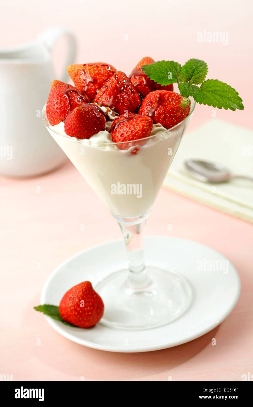 Yogurt cup with strawberries. Recipe available. Stock Photo