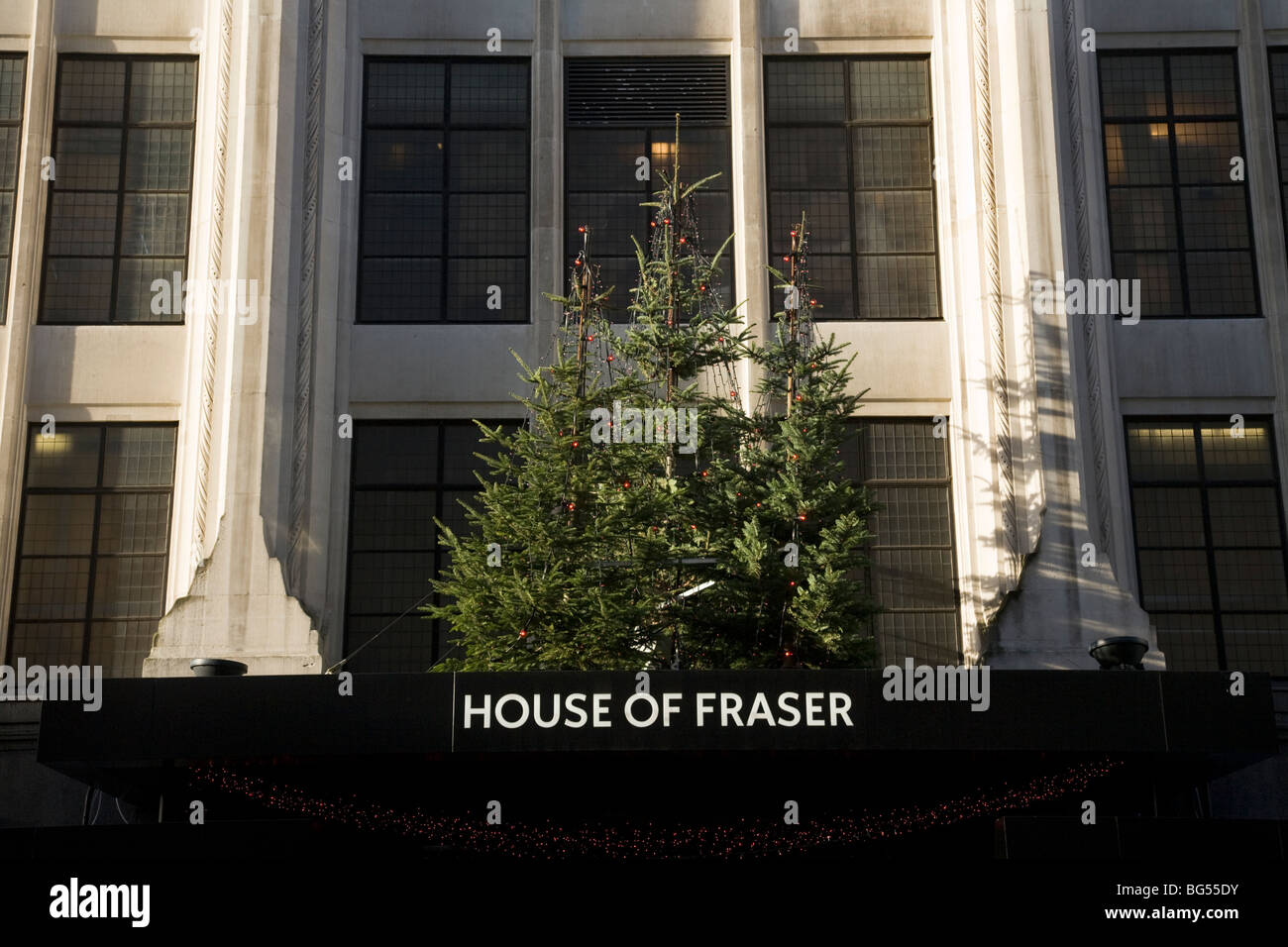 Christmas display of trees over the door of House of Fraser department store, Oxford Street. London. Stock Photo