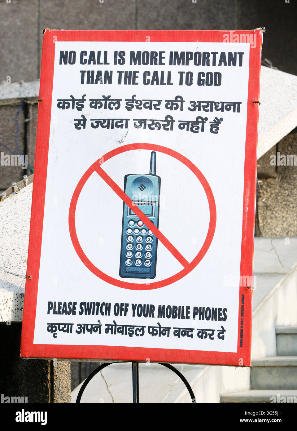 Sign before a church says 'mobile phones off please. India Stock Photo